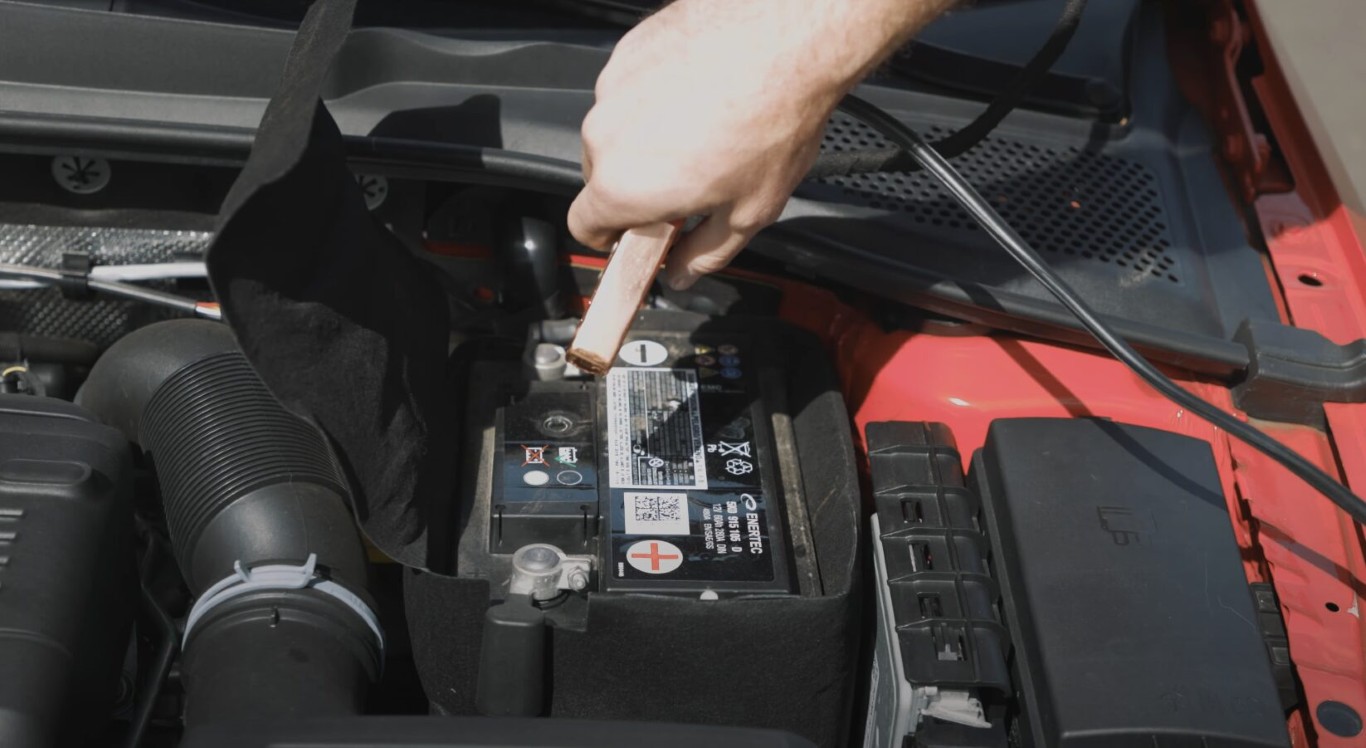 Professional technician providing battery jump start service